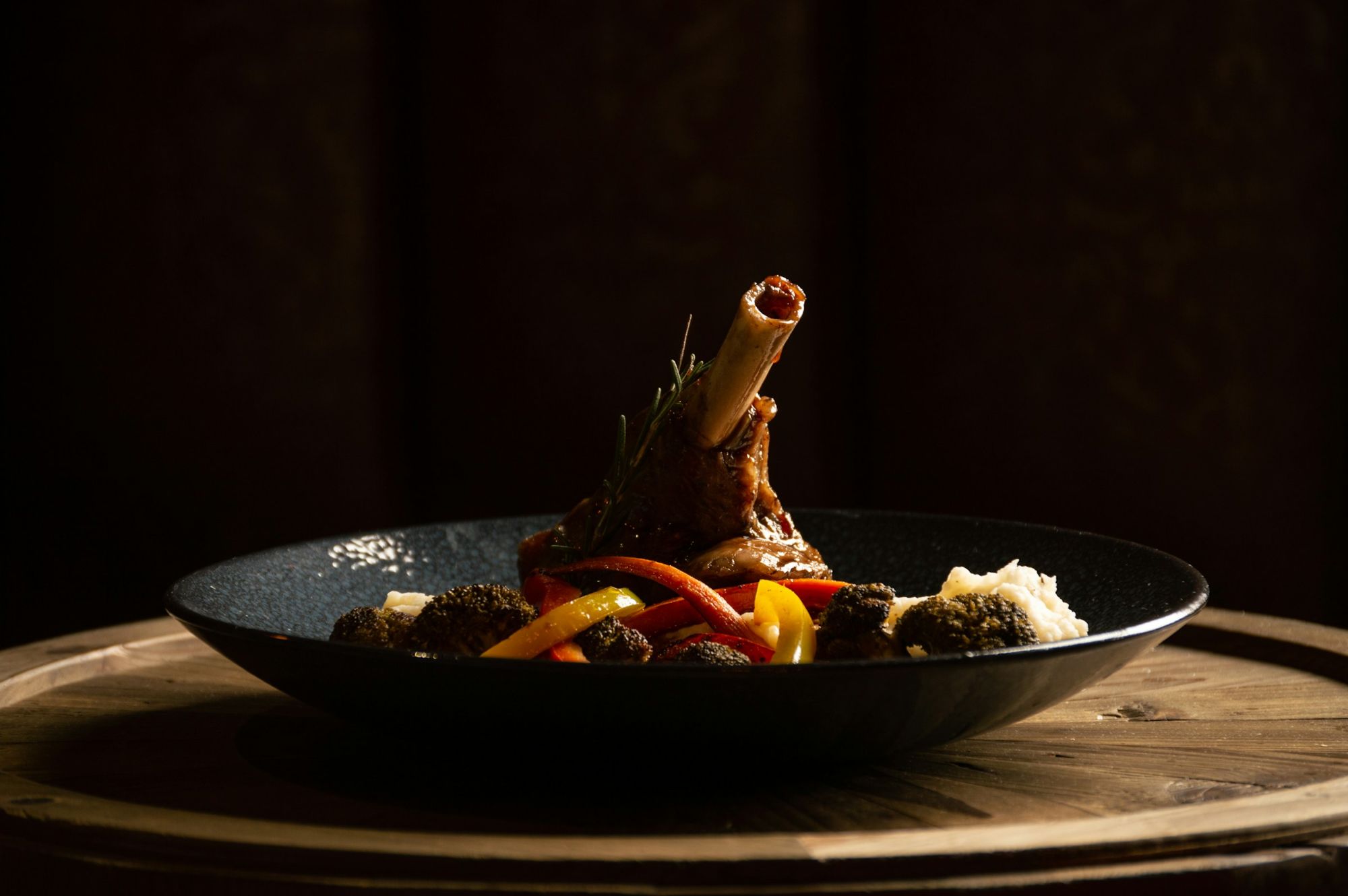 High-end plated lamb dish with vegetables